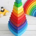 A Grimm's Wankel Stacking Tower on a wooden surface. 