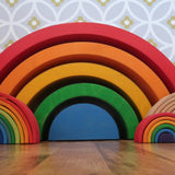 Grimm's Giant Rainbow with large, 6 piece and mini rainbows placed in front of them.