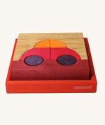 Grimm's red building set. A set of red, purple and natural wooden blocks that create a car shape when placed into the red coloured wooden storage tray that it comes with. These Grimm's toys are part of a wide range of wooden toys available here at Babipur. 