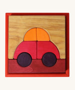 Grimm's red building set. A set of red, purple and natural wooden blocks that create a car shape when placed into the red coloured wooden storage tray that it comes with. These Grimm's toys are part of a wide range of wooden toys available here at Babipur. 