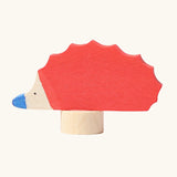 Grimm's handcrafted wooden red hedgehog decorative figure with a unpainted stand 