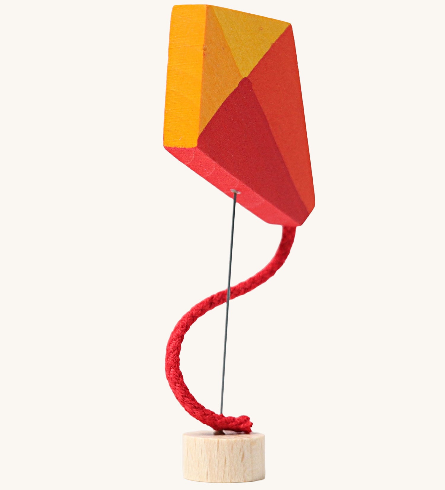 Grimm's Kite Decorative Figure, a red orange and yellow coloured kite to fit onto the Grimm's celebration ring. These Waldorf inspired decorative figures are part of a wide range of wooden decorations for celebration rings available here at Babipur. 