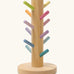 Grimms wooden sorting helper for rings with pastel dowels and a round natural base