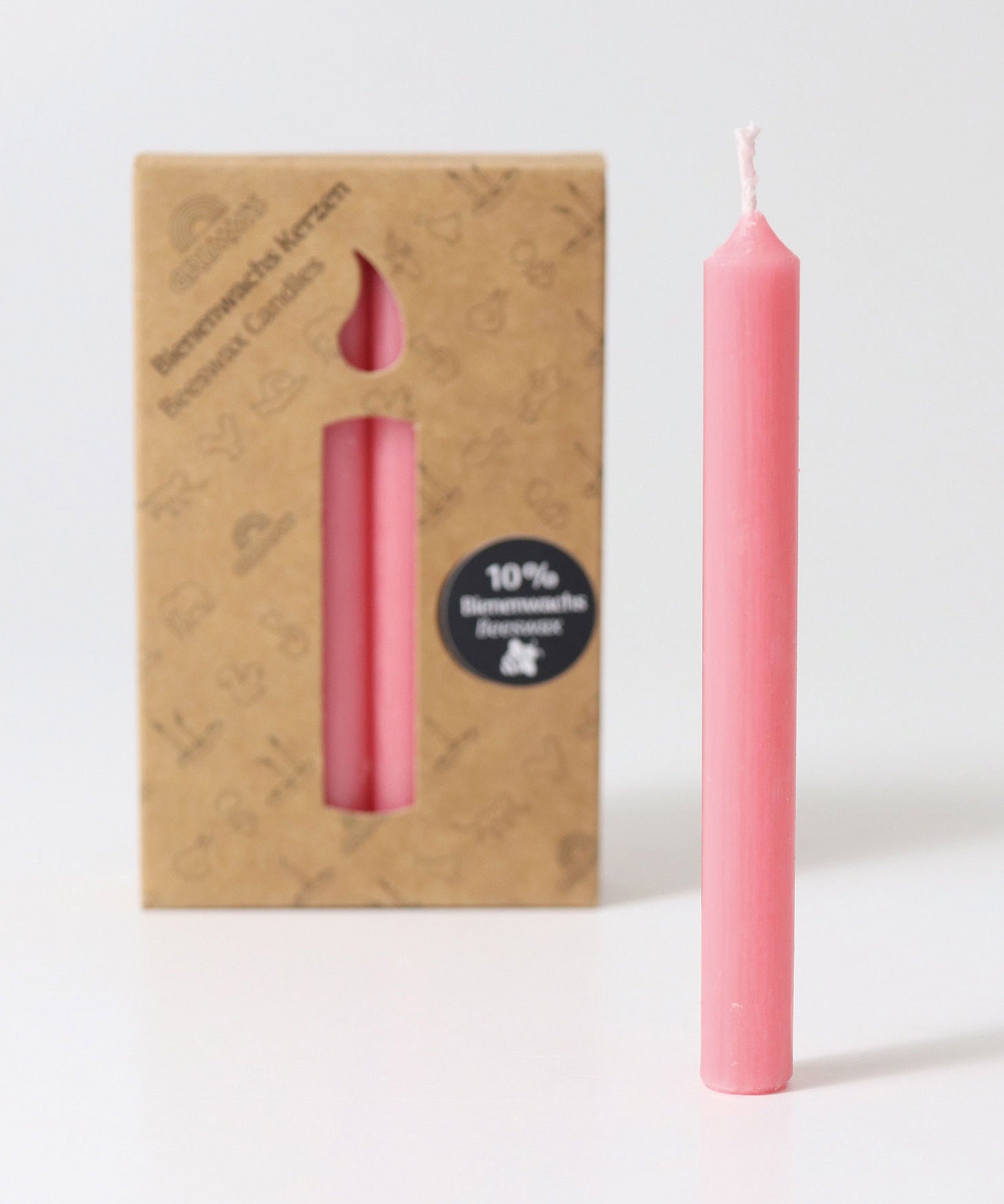 Grimm's Old Rose 10% Beeswax Candles in a 12 Pack with a single candle taken out of the box and placed at the front. 