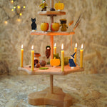 A Grimm's Seasonal Festivity Stand decorated with Autumn and Halloween themed items. 