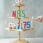 A Grimm's seasonal festivity stand decorated to celebrate the NHS's 75th birthday. The decorations Include a Bajo helicopter and ambulance