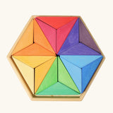 Grimms star complementary set. Contains 18 handcrafted wooden triangular pieces in a rainbow palette made for building and creative play