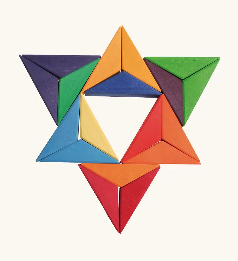 A abstract shape flatlay using pieces from the Grimms star complementary set. 