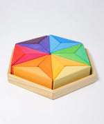 Grimms star complementary set. Contains 18 handcrafted wooden triangular pieces in a rainbow palette and tray