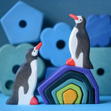 A winter display using a Grimm's small wooden earth set and Holztiger penguin figures