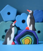 A winter display using a Grimm's small wooden earth set and Holztiger penguin figures