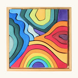 Grimms small elements set showing individual wooden pieces sitting in a frame