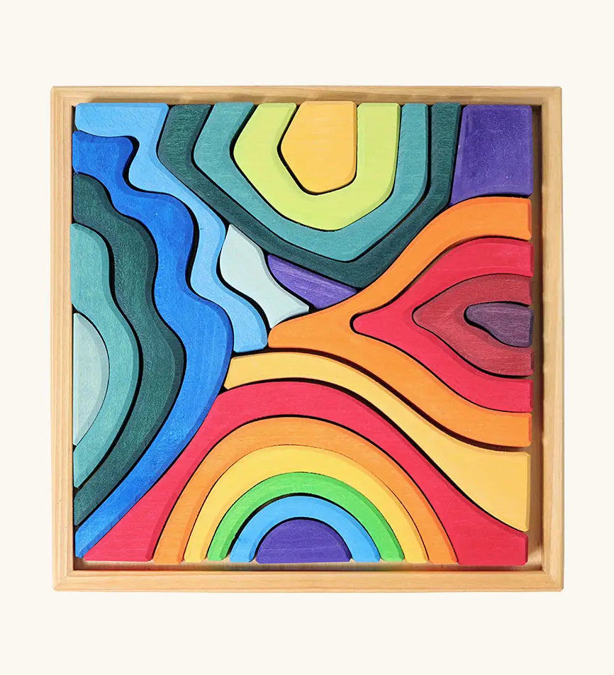 Grimms small elements set showing individual wooden pieces sitting in a frame