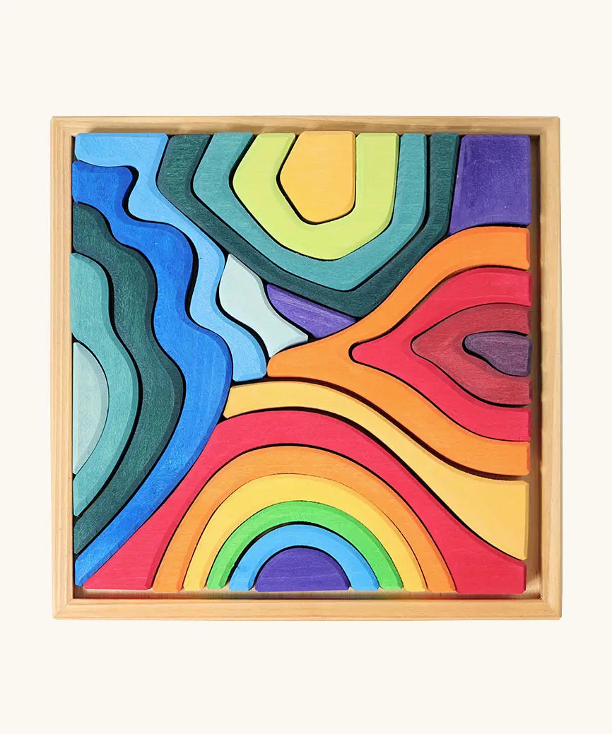 Grimms small elements set showing individual wooden pieces sitting in a frame