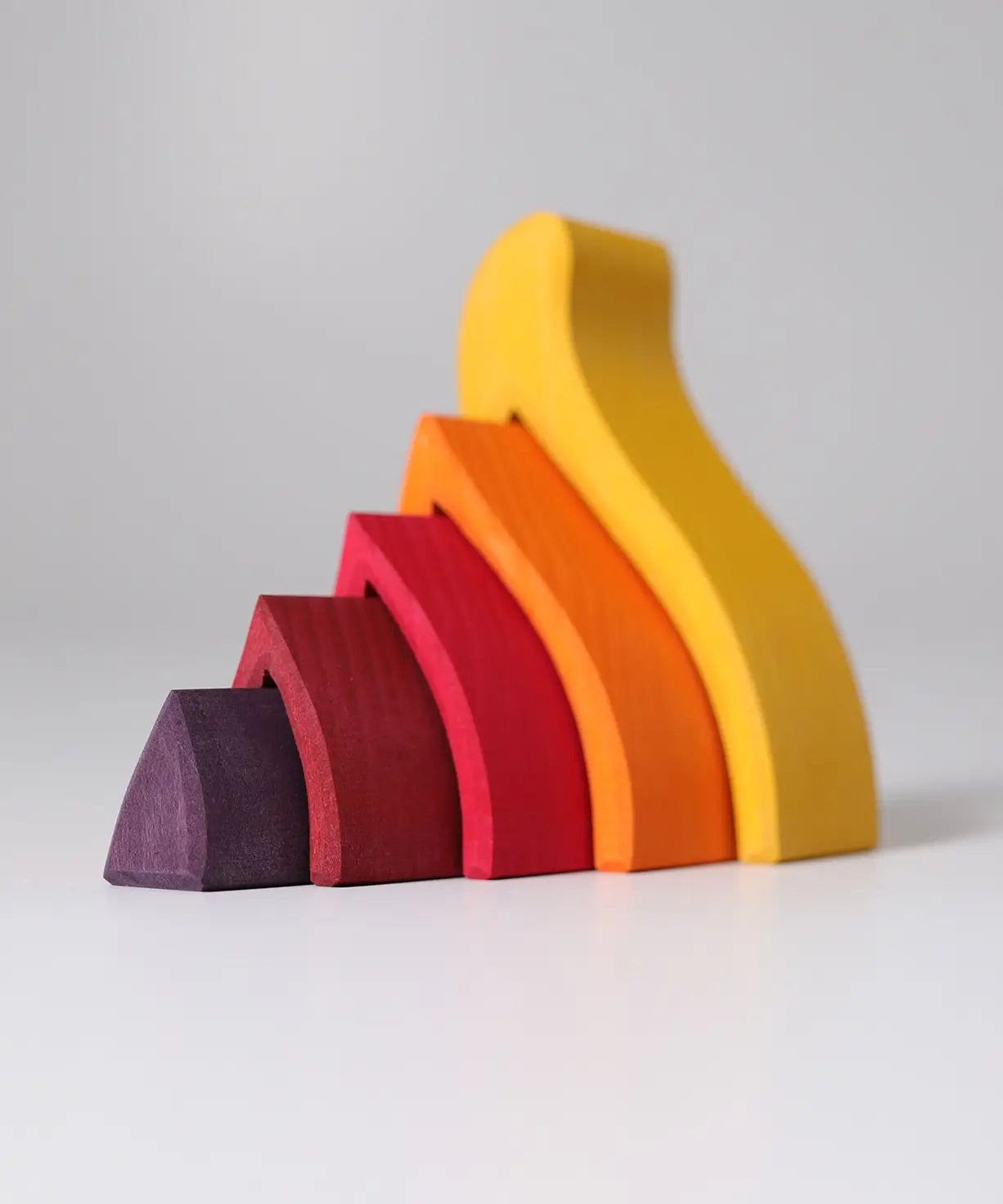 Side of the Grimms handcrafted wooden fire set showing each flame piece slotting into each other 