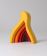 Front of the Grimms handcrafted wooden fire set showing each flame piece slotting into each other 