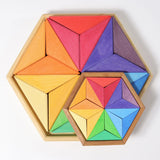 Grimms large and small star complementary wooden puzzle sets in a rainbow palette
