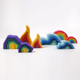Grimms large and mini earth, fire water waves and medium rainbow set lined up showing scale