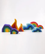 Grimms large and mini earth, fire water waves and medium rainbow set lined up showing scale