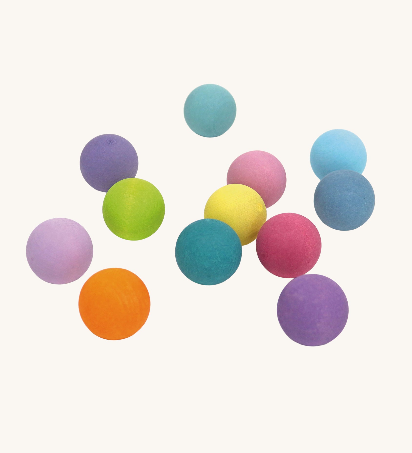 Grimm's Small Pastel wooden balls. These Grimm's toys are part of a wide range of wooden toys available here at Babipur.  