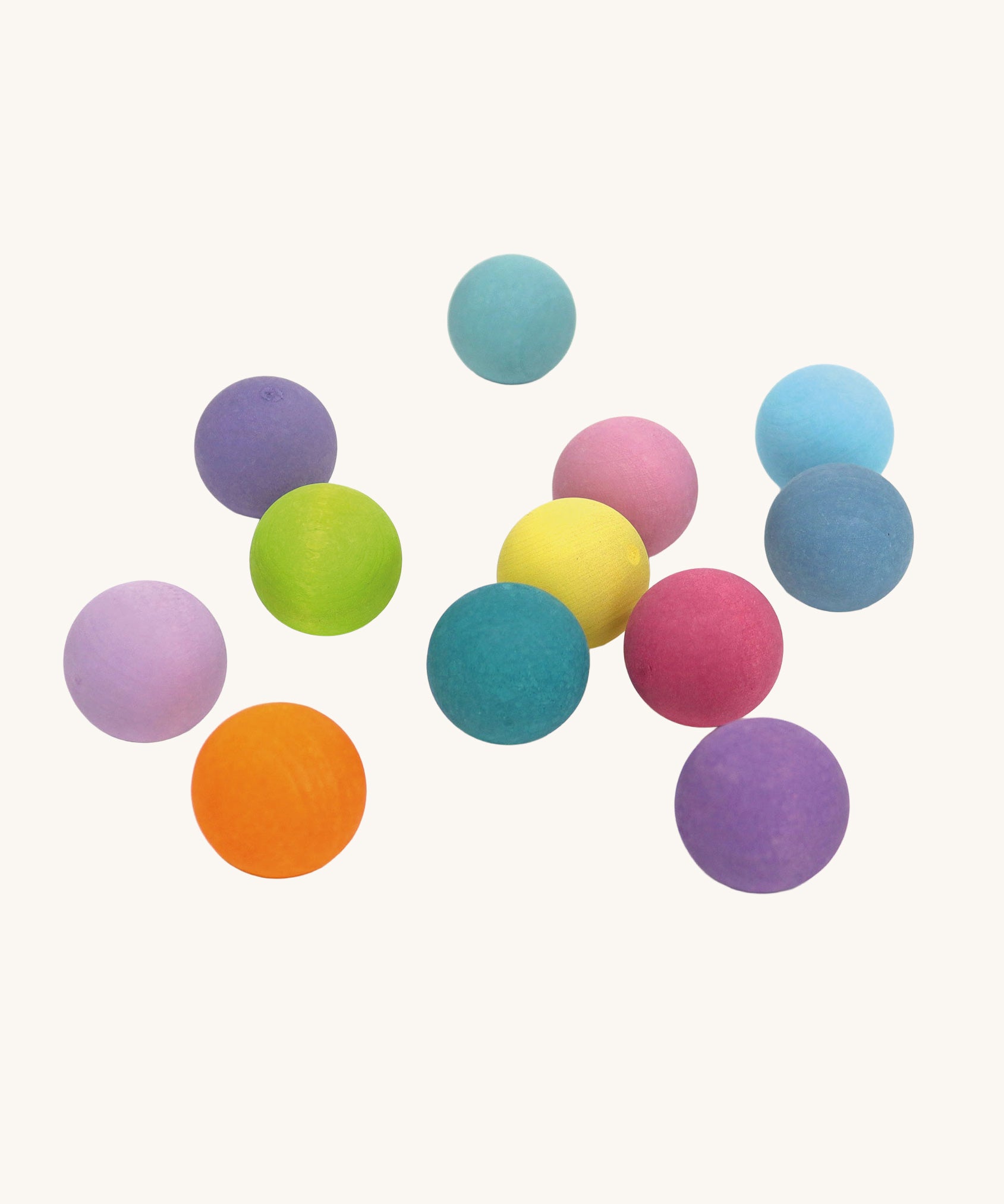 Grimm's Small Pastel wooden balls. These Grimm's toys are part of a wide range of wooden toys available here at Babipur.  