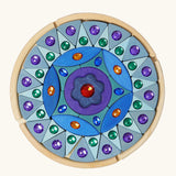 Grimms small sparkling mandala set includes purple and blue pieces in different shapes with jewels and circular frame