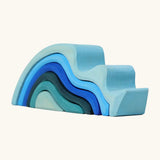 Grimms handcrafted wooden small water wave set in shades of blue. Perfect for stacking and open ended play