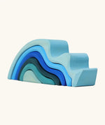 Grimms handcrafted wooden small water wave set in shades of blue. Perfect for stacking and open ended play