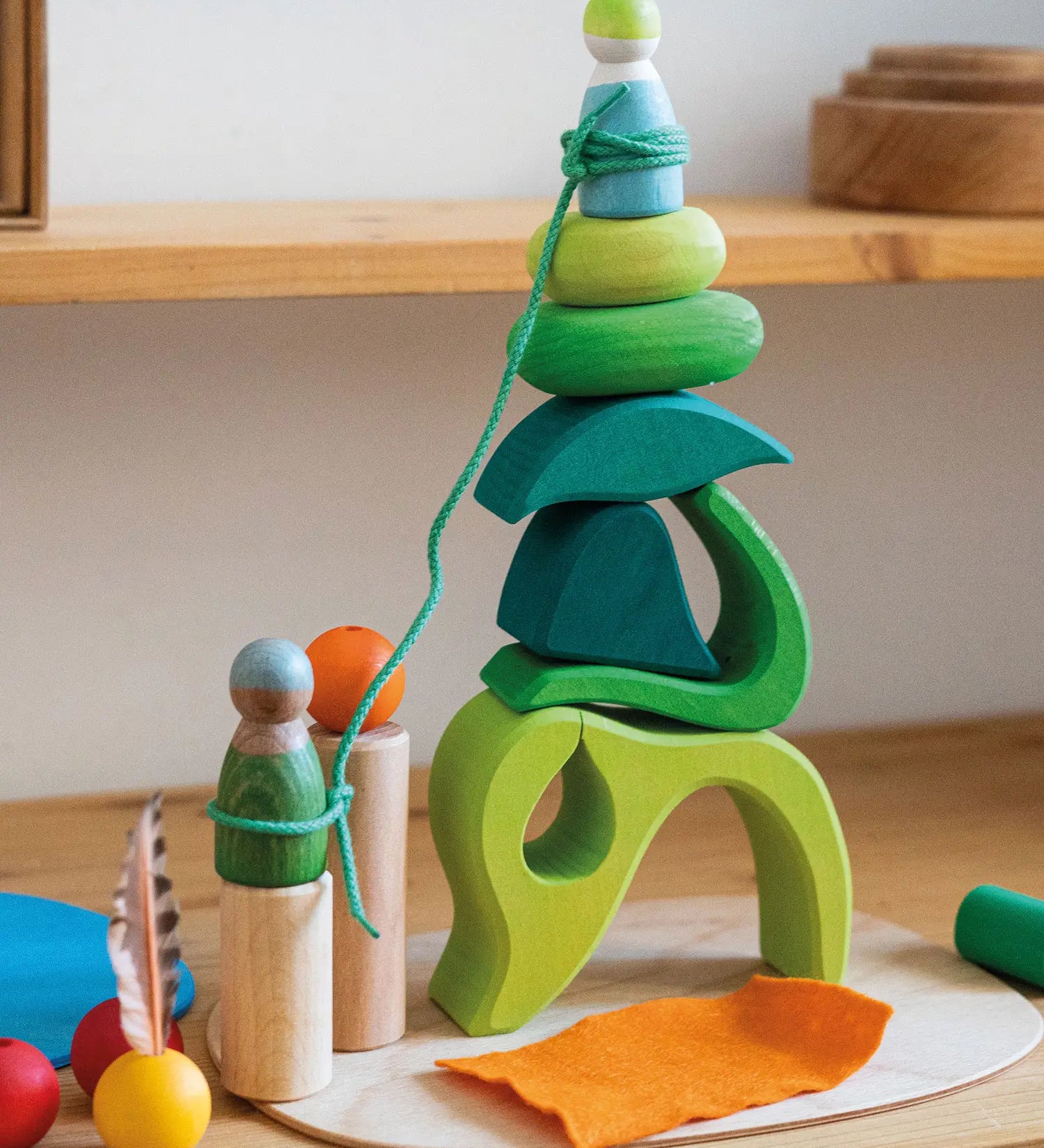 Loose blocks from the Grimms small world play in the woods set stacked on the base