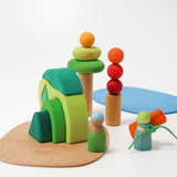 Handcrafted wooden Grimm's small world play in the woods set in a playscene