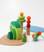 Handcrafted wooden Grimm's small world play in the woods set in a playscene