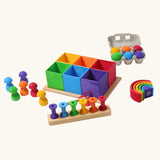 Grimm's small sorting helper wooden boxes 6 piece set with rainbow coloured toys.