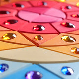 Grimms sparkling sun mandala set showing hand cut detail in the wood and jewel 