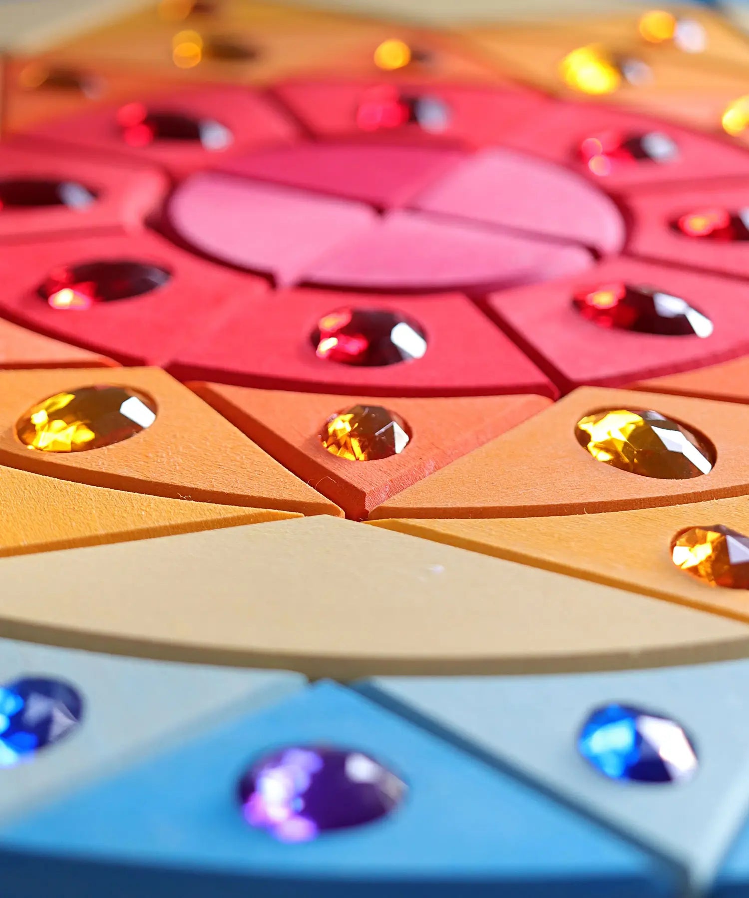 Grimms sparkling sun mandala set showing hand cut detail in the wood and jewel 