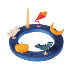 A Grimm's blue coloured celebration ring set up an decorated with Halloween themed decorative figures. 