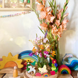 A lovely Spring inspired calendar display using a Grimm's Waldorf Celebration Ring, various Grimm's decorative figures other Grimms building sets available at Babipur.
