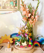 A lovely Spring inspired calendar display using a Grimm's Waldorf Celebration Ring, various Grimm's decorative figures other Grimms building sets available at Babipur.
