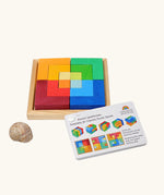 Grimm's square creative set in a wooden storage display tray next o an ideas booklet.