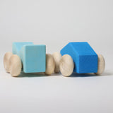 A set of two Grimm's blue wooden toy cars that can be stacked on top of each other. These Grimm's toys are part of a wide range of wooden toys available here at Babipur. 