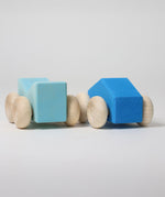 A set of two Grimm's blue wooden toy cars that can be stacked on top of each other. These Grimm's toys are part of a wide range of wooden toys available here at Babipur. 
