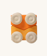 A set of two Grimm's orange wooden toy cars that can be stacked on top of each other. These Grimm's toys are part of a wide range of wooden toys available here at Babipur. 