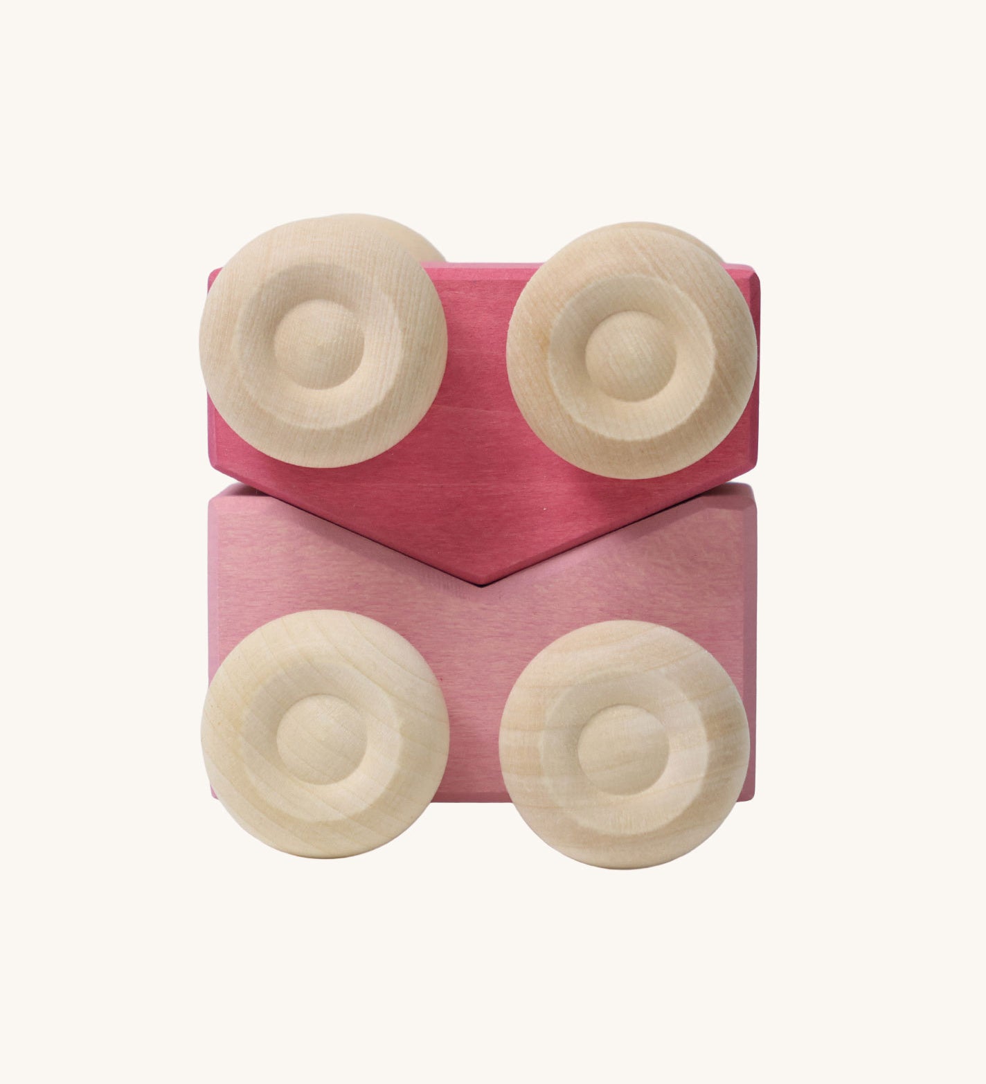 A set of two Grimm's pink wooden toy cars that can be stacked on top of each other. These Grimm's toys are part of a wide range of wooden toys available here at Babipur. 