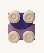 A set of two Grimm's purple wooden toy cars that can be stacked on top of each other. These Grimm's toys are part of a wide range of wooden toys available here at Babipur. 