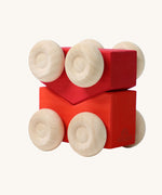 A set of two Grimm's red wooden toy cars that can be stacked on top of each other. These Grimm's toys are part of a wide range of wooden toys available here at Babipur. 