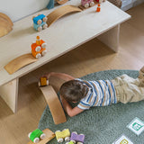 A child playing with the Grimm's Stacking Cars and the Grimm's natural bridges. Wooden toy cars that comes in a two back that can can be stacked on top of each other.
These Grimm's toys are part of a wide range of wooden toys available here at Babipur. 