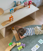 A child playing with the Grimm's Stacking Cars and the Grimm's natural bridges. Wooden toy cars that comes in a two back that can can be stacked on top of each other.
These Grimm's toys are part of a wide range of wooden toys available here at Babipur. 