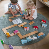Chldren playing with the Grimm's Stacking Cars and Grimm's natural building boards. Wooden toy cars that comes in a two back that can can be stacked on top of each other.
These Grimm's toys are part of a wide range of wooden toys available here at Babipur.