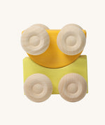 A set of two Grimm's yellow wooden toy cars that can be stacked on top of each other. These Grimm's toys are part of a wide range of wooden toys available here at Babipur. 
