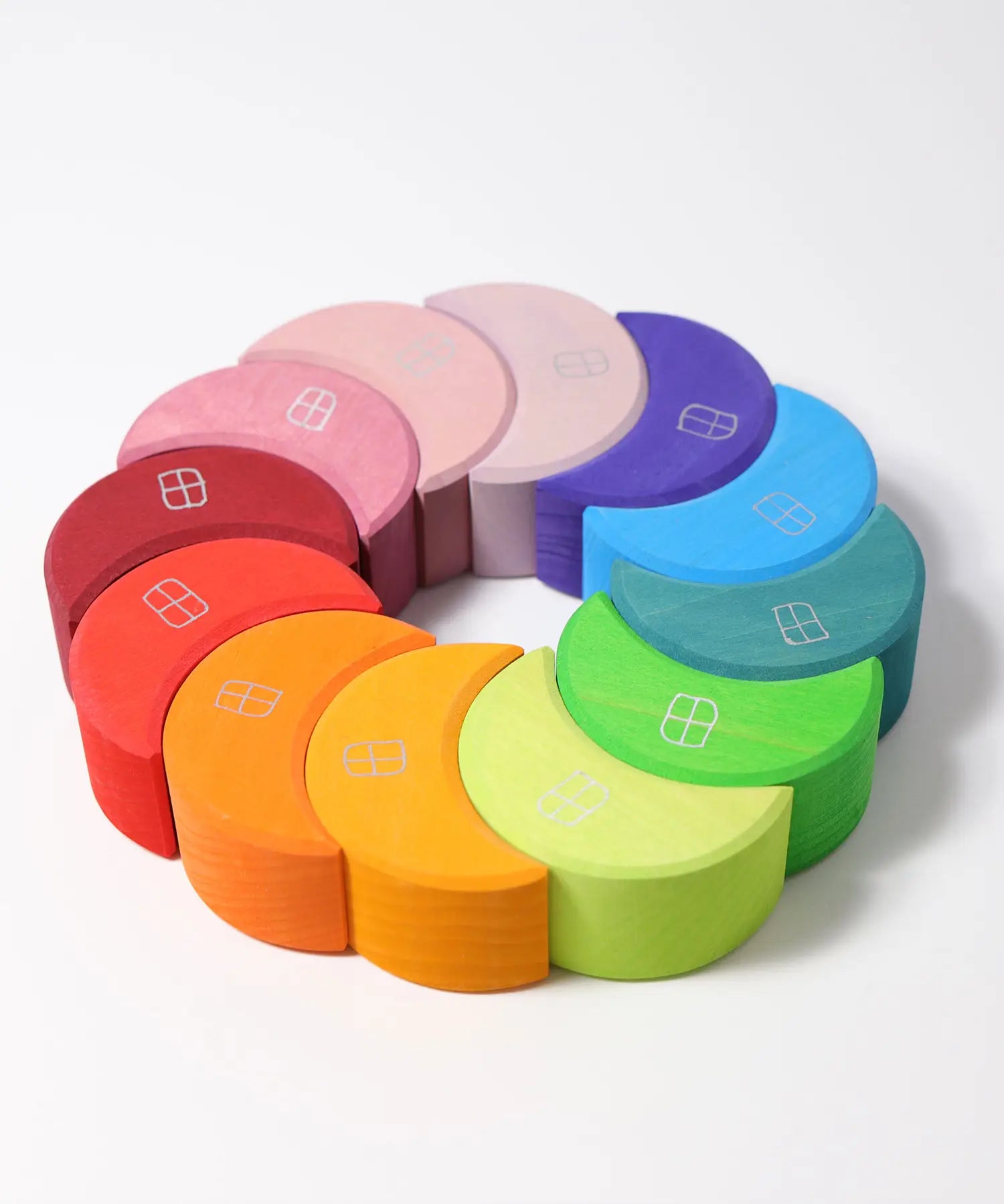 Grimms wooden stacking moon shapes houses laid flat in a circle shape