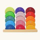 Grimms stacking moon shapes houses. Contains 15 handcrafted wooden crescent shaped blocks with a decorative window and door on the front